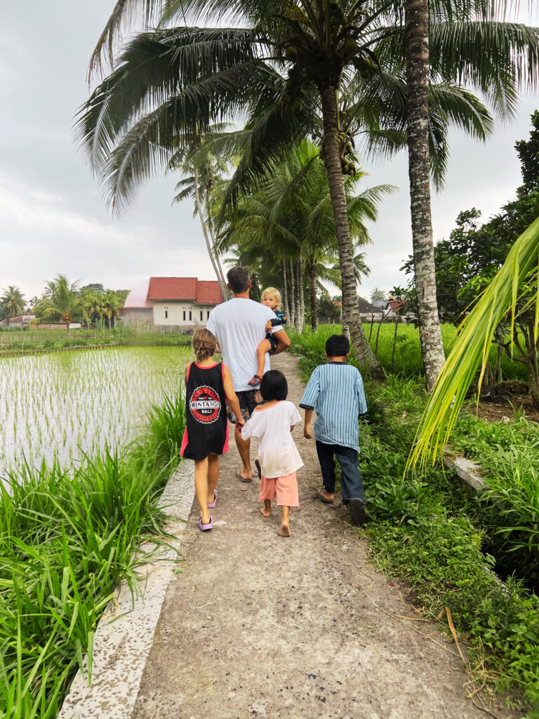 Family Travel in Lombok, Indonesia, children exploring a village with local kids, mindful parenting adventures.